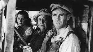Tom Joad en compagnie de Man et Rose de Sharon (adaptation cinématographique des Raisins de la Colère de 1949 de John Ford)